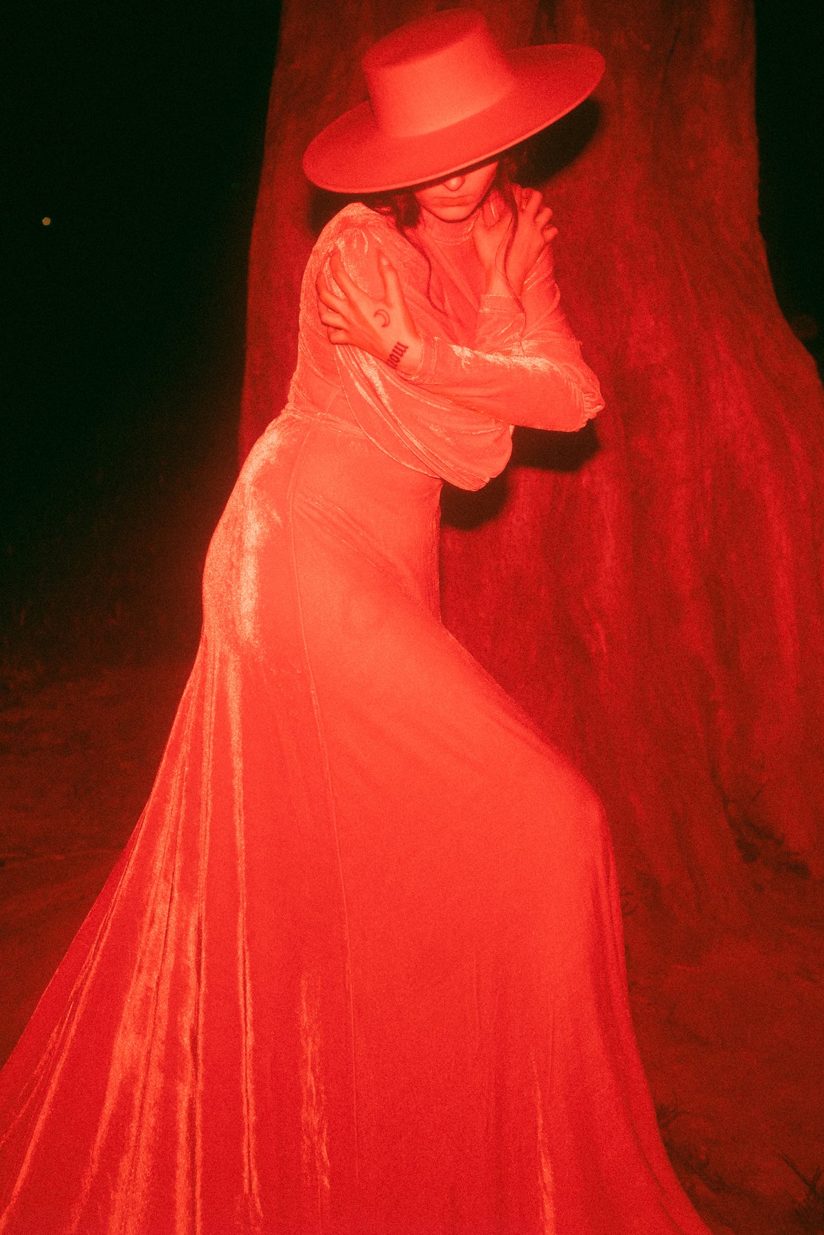 The red Arcadia Dress by Katakomb is a modern homage to medieval artistry. With its soft, stretchable polyester construction, flowing maxi design, mock turtleneck, and ethereal bishop sleeves, this gothic-inspired gown captures both strength and romance — an enchanting statement piece for any alternative wardrobe.