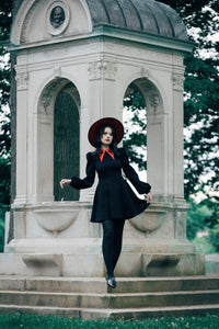 This black Baptism Dress offers a perfect blend of style and comfort, featuring a large pointed collar with understated cross embroidery. Choose the black collar for a classic, refined look or the red collar for a playful touch. Puff shoulders and bishop sleeves add a dramatic, elegant flair, and the thick high-stretch ponte fabric ensures you stay cozy, warm, and free to move with ease during any special event.