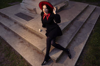 Make every moment magical with this black Baptism Dress, complete with a large pointed collar accented with gentle cross embroidery. The dress comes with a choice of a solid black or vibrant red collar, creating either a refined or eye-catching look. Dramatic puffed shoulders and soft bishop sleeves give the dress a sense of movement and elegance, while the thick, stretchy ponte fabric ensures your child stays cozy and comfortable throughout the day.