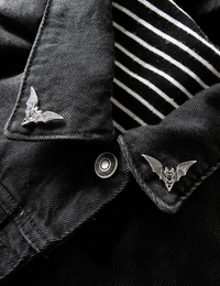 Set of silver metal and black enamel bat enamel pins, 1.3 x 0.8 inches each, designed with Ectogasm’s signature etching style. Dual tie tacks keep pins secure, ideal for collars, jackets, bags, or creating a cohesive set of gothic accessories for alternative fashion.