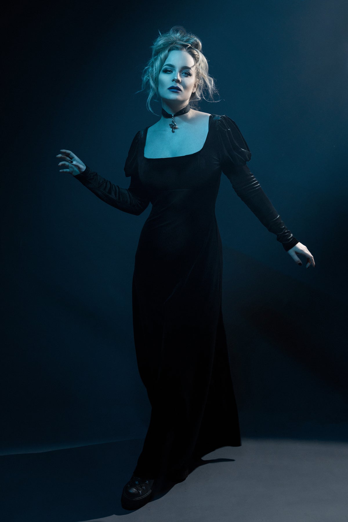 This black velvet Daphne Dress merges vintage Regency inspiration with modern gothic charm. Designed from soft, stretchy polyester velvet, it features a classic empire waist that enhances natural curves, long puffed sleeves for a dramatic silhouette, and a scoop neck that exudes feminine grace. A perfect blend of Victorian allure and dark romantic style for evening wear or elegant alternative fashion.