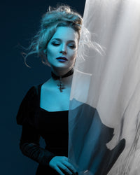 The Daphne Dress channels dark romantic energy with its Regency-inspired empire waist and Audrey Hepburn–inspired sophistication. Made from high-quality black velvet polyester, it offers a luxuriously soft, stretchy texture. The long puffed sleeves and delicate scoop neckline make it an ideal piece for gothic fashion enthusiasts who appreciate a touch of vintage glamour.