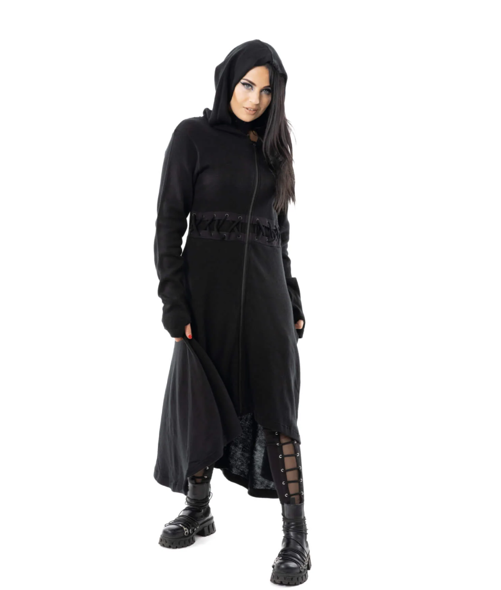 Stylish and edgy Demille Cardigan in black polyacrylic with corset-style front and back lacing, full-length flowing design, oversized hood, zip closure, high-low hem, and thumbholes, offering a moody silhouette suitable for layering over dresses or casual outfits in alternative fashion wardrobes.