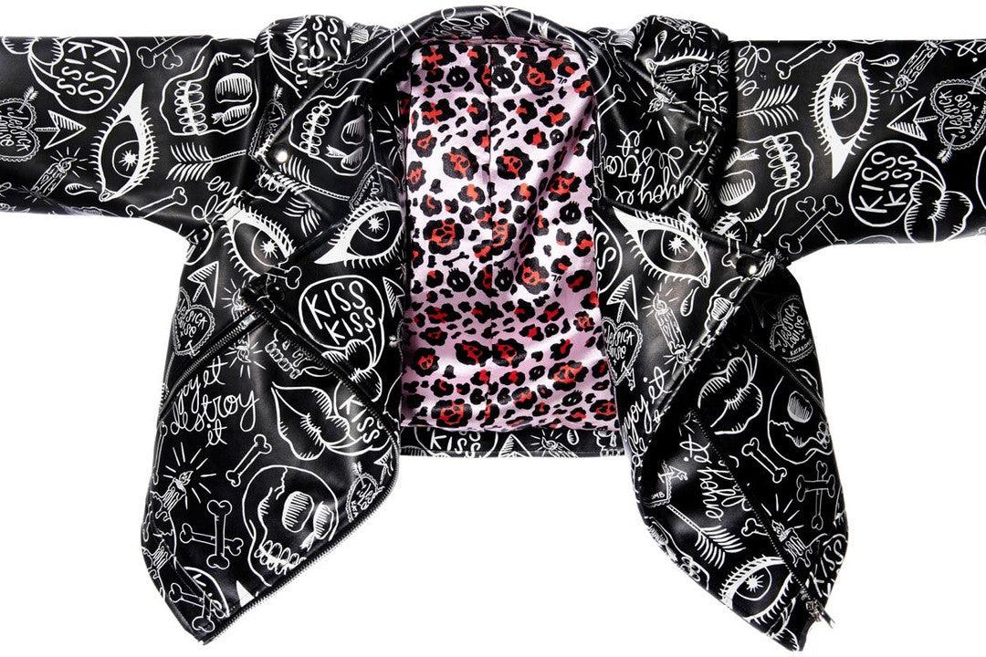Cropped Graffiti Moto Jacket by Jessica Louise with eye-catching artwork, featuring custom leopard print lining, functional pockets, and a striking exposed metal zipper with skull logo pull, combining artistic streetwear design with practical biker-inspired details.