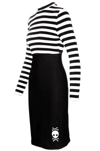 The Jailhouse Dress is a body-hugging, stretchy pin-up style dress with a mock turtleneck, striped sleeves, and skull embroidery detail, merging rockabilly glamour with punk edge, ideal for those who love gothic and alternative streetwear with an artistic twist.