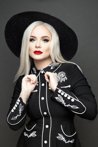 Sophisticated yet playful women’s skater dress with detailed rose and thorn embroidery on the collar, cuffs, bust, and hips, accented with white piping, long piped sleeves with faux snap cuffs, a flattering flared skater skirt, and convenient deep pockets, making it a stylish choice for casual, work, or evening wear.