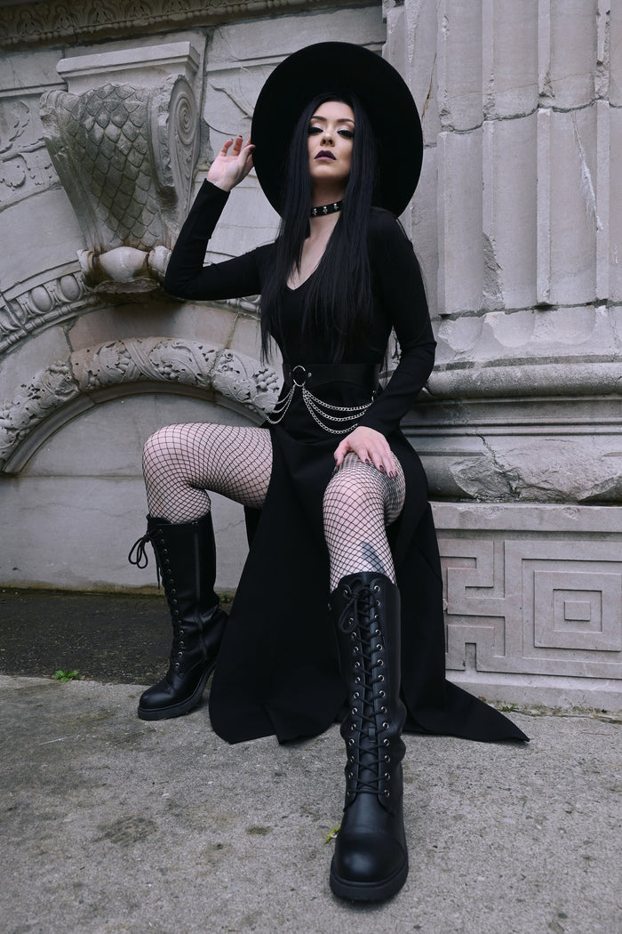 The Kassandra Maxi Dress in a sleek, body-hugging silhouette designed with a soft, flexible poly blend fabric that moves with you. Its plunging neckline and dual thigh slits add sensual charm while maintaining tasteful coverage, ideal for transitioning from casual daytime lounging to glamorous evening wear.