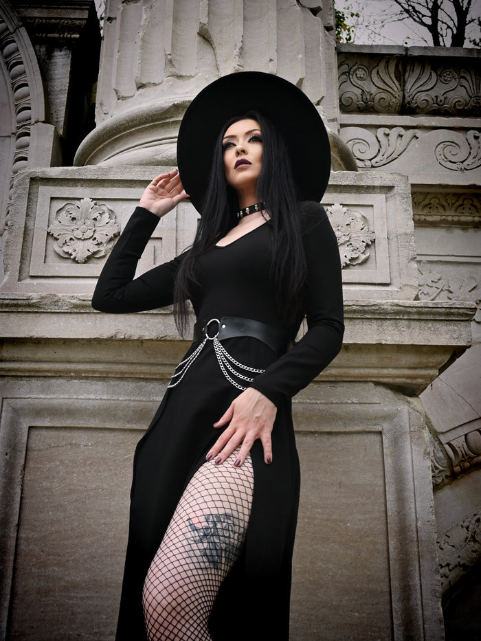 Elegant and versatile, the Kassandra Maxi Dress showcases a figure-embracing fit in a smooth, stretchy poly blend fabric. Designed with two daring thigh-high slits and a flattering deep neckline, it seamlessly transitions from laid-back afternoons to elevated evening events.