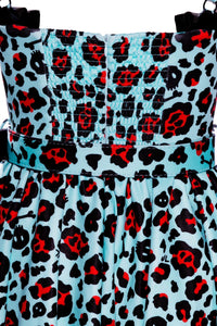 Jessica Louise Love Bites Swing Dress in custom Leopard Print, designed with a classic fit-and-flare silhouette, a sweetheart neckline with ruffled accents and ribbon bow, enlarged cup sizing for confidence, side seam pockets for essentials, ruched back for easy dressing, adjustable straps for a personalized fit, and high-stretch fabric for comfort, perfect for women seeking bold, playful, and practical statement pieces.