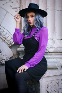 Fashion-forward semi-sheer mesh top with long sleeves, dramatic pointy collar, oversized embroidered cross details, a daring keyhole back cut-out, and soft stretchy material, perfect for gothic clothing collections, edgy street fashion, or clubbing and festival styling.