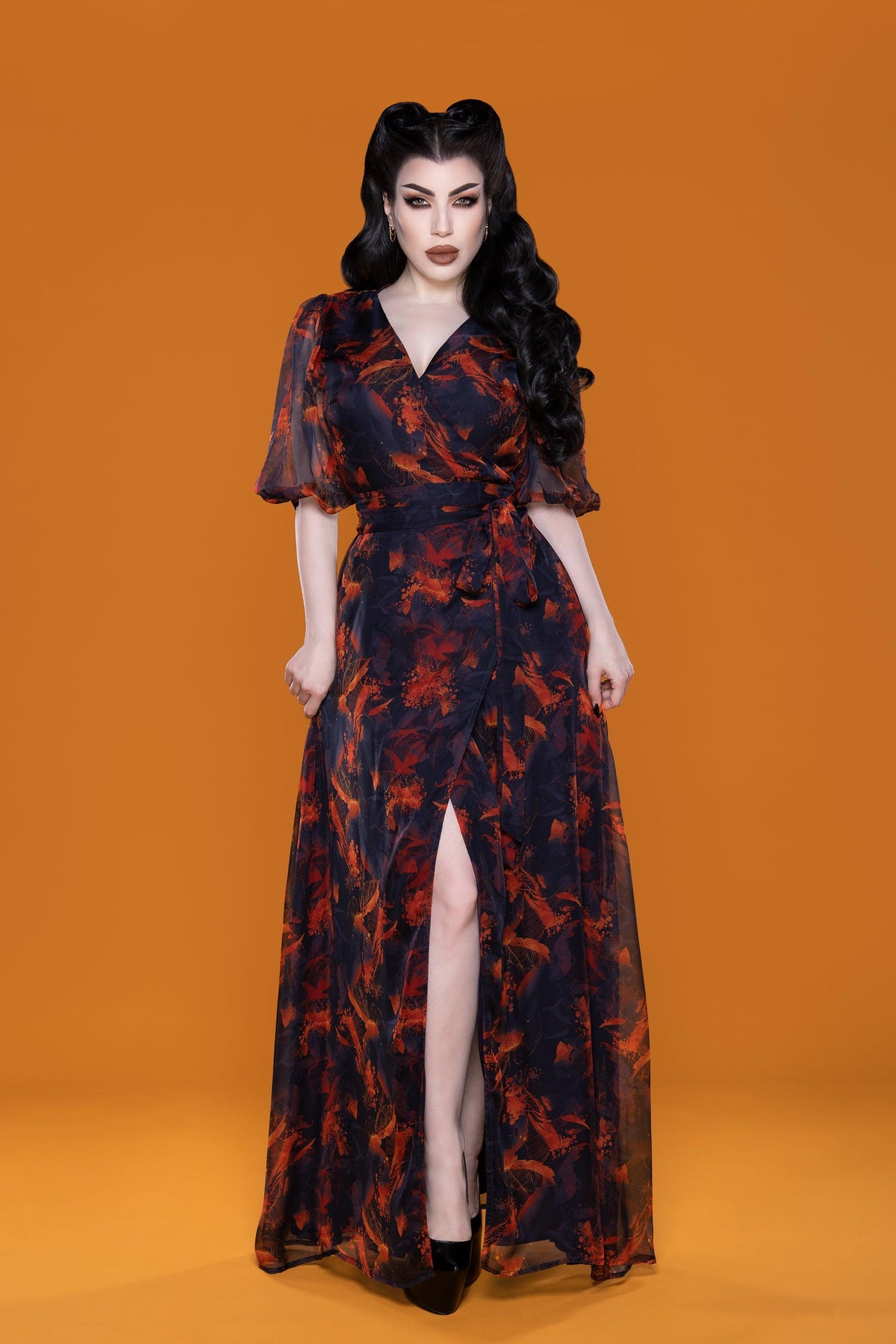 Elegant Winona Maxi Dress with Autumn Leaves Print, airy chiffon fabric, front wrap V-neckline, flared bishop sleeves, and a floor-length skirt. Perfect for transitioning from a relaxed day at the beach to stylish nights out, combining effortless comfort with timeless fall-inspired style.