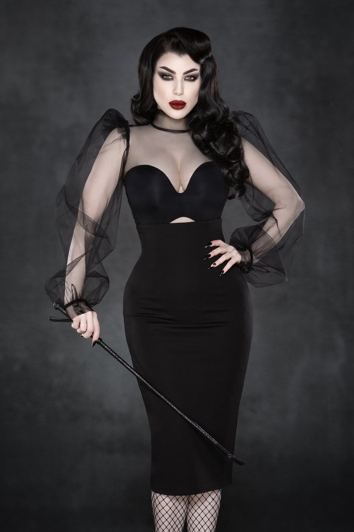 Elegant black chiffon blouse with a Gothic aesthetic, boasting voluminous puffed sleeves, a high stiff collar, and structured shoulders, complemented by a button-up back that enhances its dramatic and high-fashion look, ideal for pairing with skirts, trousers, or layered outerwear.