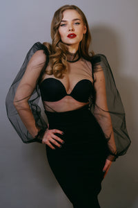 Gothic-inspired black chiffon blouse with see-through sheer panels, voluminous puff sleeves, high stiff collar, and structured shoulders, designed with a button-up back to provide an elegant, dramatic silhouette that elevates any formal or avant-garde outfit.