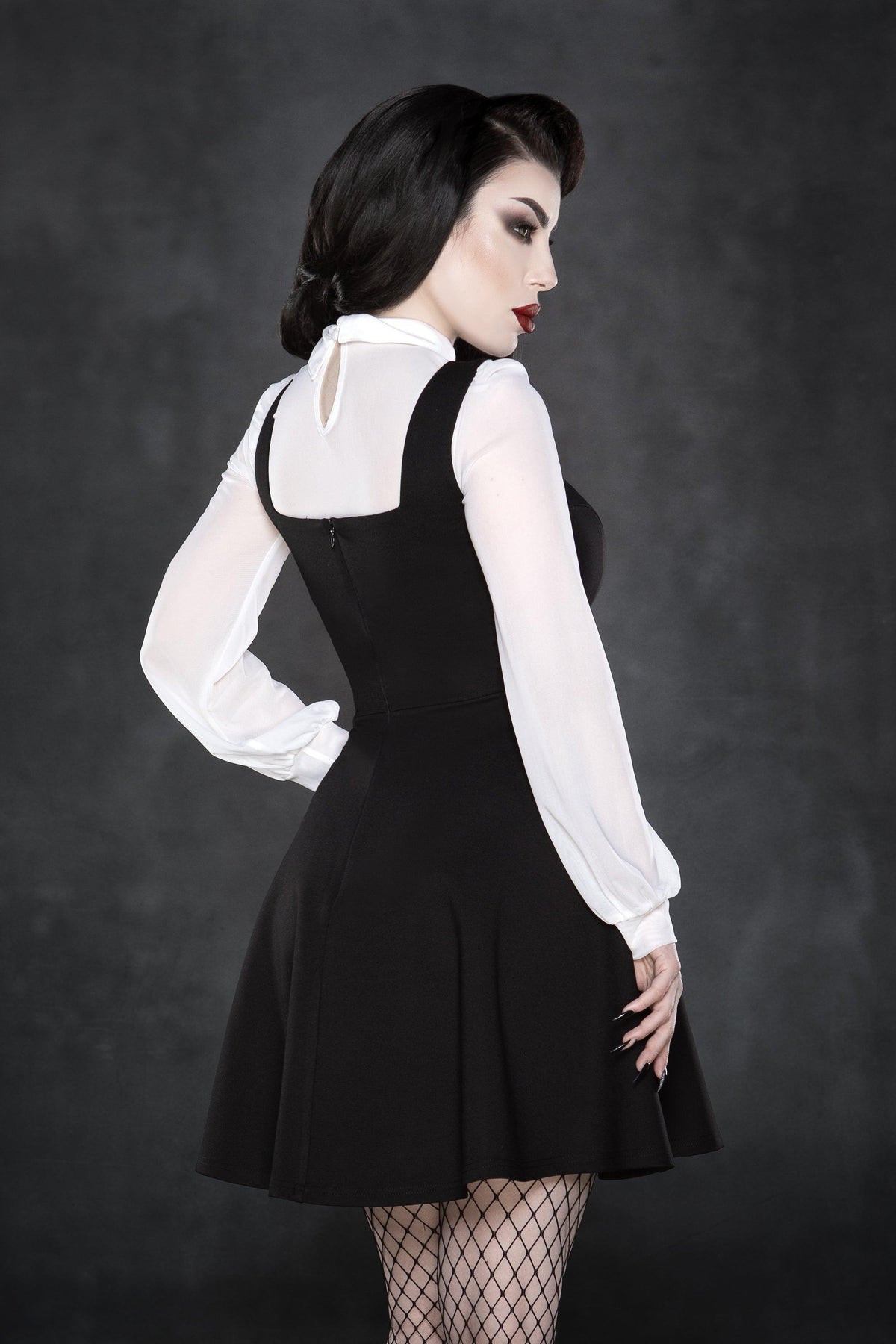 Stretchy soft mesh long-sleeve top with dramatic pointed collar, bold embroidered crosses, semi-sheer fabric, a daring keyhole back cut-out, and versatile colors, designed for gothic fashion, alternative streetwear, festival ensembles, and nightlife-ready statement looks.