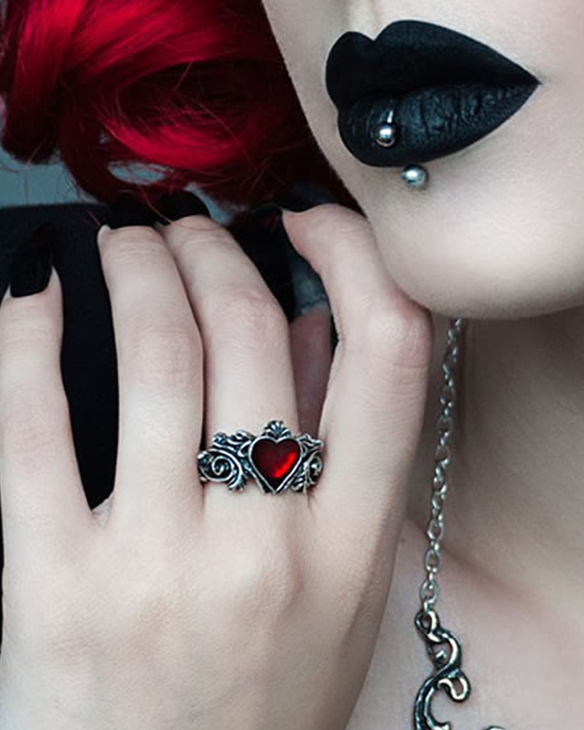 Alchemy miniature pewter ring featuring a red enamel heart set in intricate floret detailing. Elegant gothic accessory symbolizing love and passion, handmade in England.