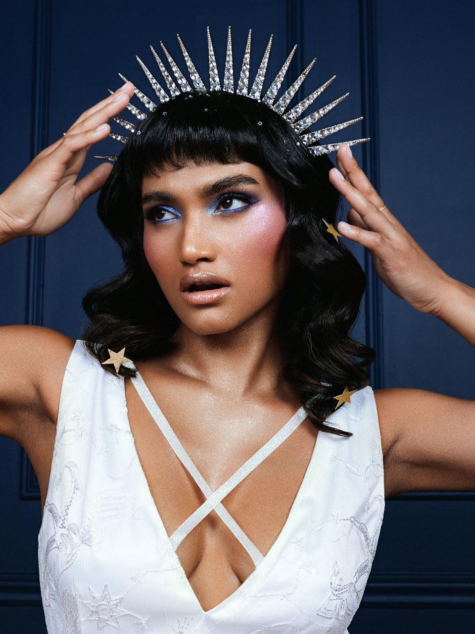 Elegant Celestial Dress made from embroidered chiffon with delicate constellation designs, available in classic black and white. The maxi-length silhouette, sparkly fabric, low neckline, and cross-strap details create a sophisticated and modern look, ideal for formal events, cocktail parties, or stylish evening outings.