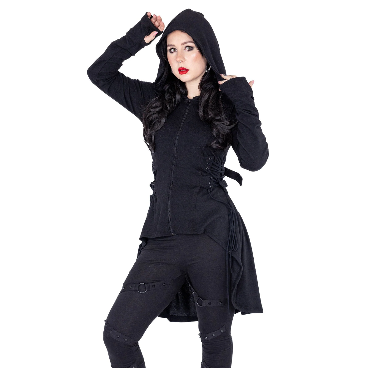 Heartless lightweight black hoodie made from soft polyester, designed with a high-low hem, corset-inspired lacing at the sides, adjustable back ties, fitted silhouette, thumbholes, and oversized hood, perfect for adding subtle edge and comfort to year-round outfits.