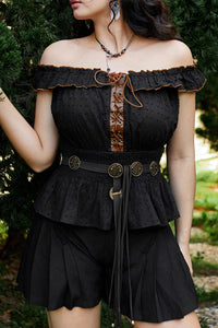 Adjustable one-size Concho Tie Belt featuring silver Western-style medallions along a soft strap. Perfect for gothic, alternative, or boho outfits, it adds bold detailing to dresses, tunics, and oversized shirts.