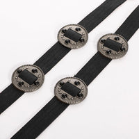 One-size adjustable Concho Tie Belt with Western-inspired silver medallions. Adds bold, stylish accent to gothic, punk, or boho looks, perfect for layering over dresses, tunics, or oversized shirts.