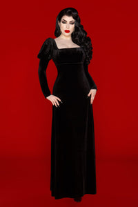 A statement of gothic elegance, the Daphne Dress is crafted from plush black velvet polyester that’s both soft and elastic. The empire waist flatters the figure, while the puffed Victorian-style sleeves and scoop neckline evoke a sense of romantic refinement. Inspired by Audrey Hepburn’s dress in War and Peace, this piece is perfect for those drawn to dark, historical-inspired fashion.