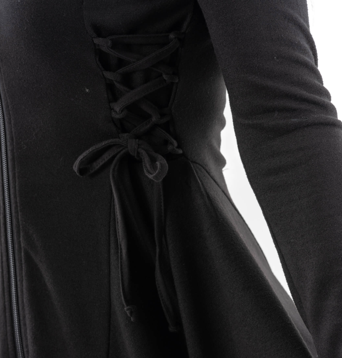 Dramatic mid-length black Emerson Cardigan by Innocent Lifestyle with hood, zip closure, soft flowing drape, corset-style lacing at sides and back, and handkerchief hem, crafted from 100% polyester for versatile everyday or evening styling.