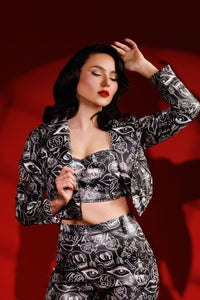 Edgy graffiti moto jacket for women showcasing Jessica Louise artwork, complete with cropped silhouette, luxurious leopard print lining, two functional pockets, and bold exposed zipper with custom skull logo, ideal for statement street style or biker chic outfits.