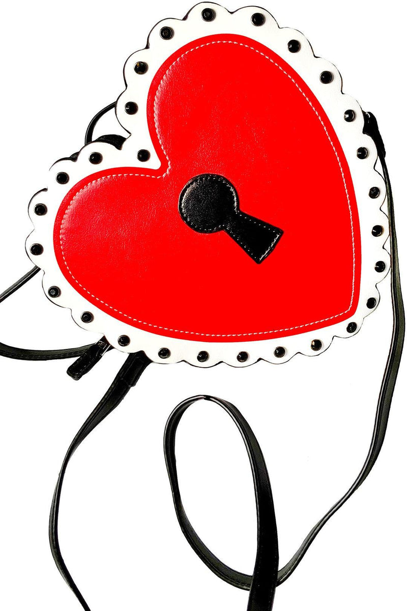 Romantic and eye-catching Heart Locket Purse featuring a black matte keyhole centerpiece, white scalloped detailing, and black jewel studs, ideal for pairing with bold outfits or enhancing a feminine, vintage-inspired wardrobe.