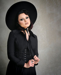 Elevate your style with the Homemaker Swing Dress in black. Crafted from high-stretch Bengaline fabric, this midi-length dress offers both structure and comfort. The long sleeves and hidden front button placket enhance its classic tailoring, while the functional side pockets add practicality. The flared skirt creates a dramatic silhouette that moves beautifully with every step, making it a perfect choice for those seeking a blend of sophistication and Gothic romance.