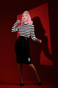 Red version of the Jailhouse Dress combining vintage pin-up style with punk attitude, showcasing a striped long-sleeve top and form-fitting bengaline skirt adorned with embroidered skull details by artist Jessica Louise, perfect for alternative fashion lovers who want a bold and comfortable statement piece.