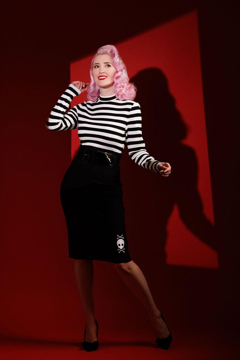 Red version of the Jailhouse Dress combining vintage pin-up style with punk attitude, showcasing a striped long-sleeve top and form-fitting bengaline skirt adorned with embroidered skull details by artist Jessica Louise, perfect for alternative fashion lovers who want a bold and comfortable statement piece.