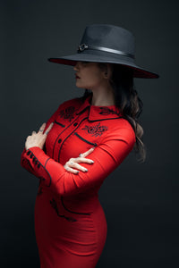 A western gothic red dress designed for elegance and attitude, the June Dress by Katakomb features luxurious stretch bengaline material, pleather piping, and intricate embroidery that tells a story of roses and thorns. The faux snap cuffs and seamless front snaps give it a clean, structured look suitable for dark vintage and retro-inspired outfits.