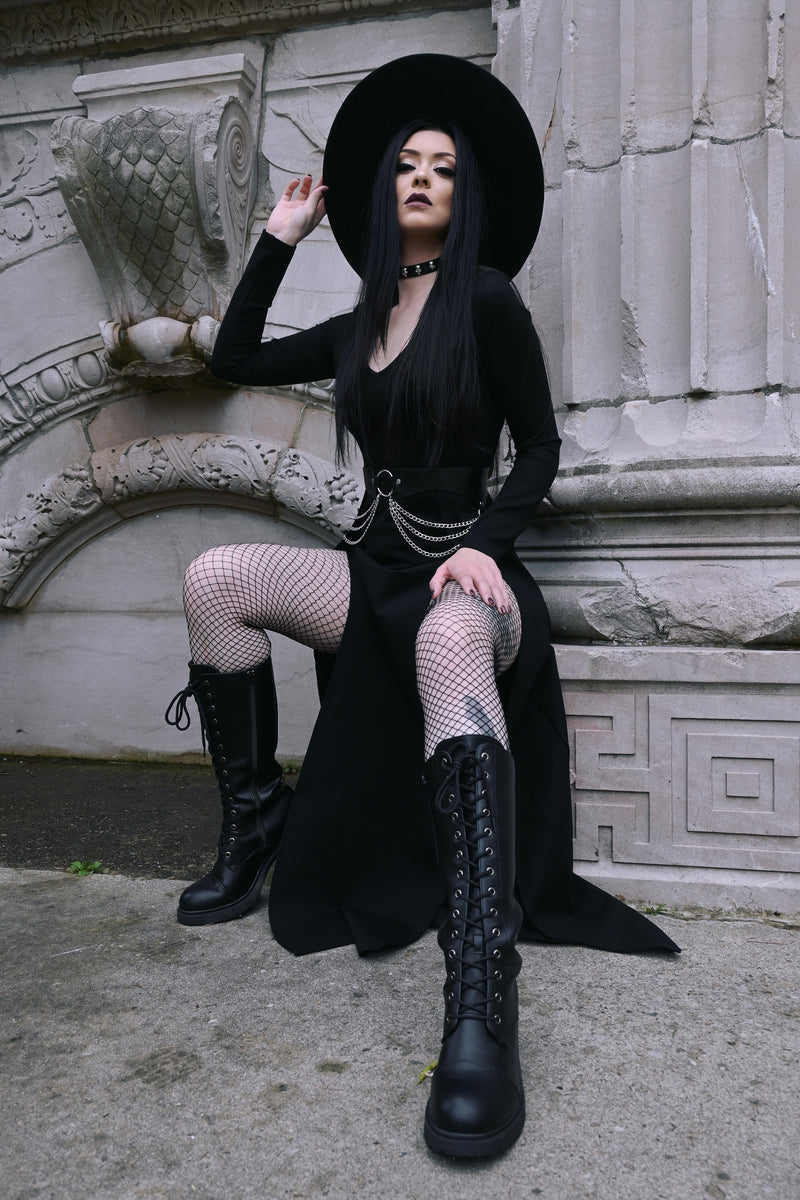 The Kassandra Maxi Dress in a sleek, body-hugging silhouette designed with a soft, flexible poly blend fabric that moves with you. Its plunging neckline and dual thigh slits add sensual charm while maintaining tasteful coverage, ideal for transitioning from casual daytime lounging to glamorous evening wear.