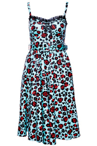 Bold and stylish Love Bites Swing Dress by Jessica Louise in Leopard Print, showcasing a classic fit-and-flare silhouette with a sweetheart neckline, charming ruffles, and a ribbon bow accent, enhanced cup sizing for all-day comfort, convenient side pockets, ruched back detailing, and adjustable straps, designed to combine edgy “bad girl” style with functional, comfortable wear.