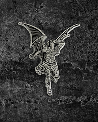 Large silver and black enamel gothic pin by Ectogasm inspired by Gustave Doré’s illustration for Milton’s "Paradise Lost," featuring a winged Lucifer fallen from grace. Measures 2.2 x 1.8 inches with dual metal clasps for secure wear, perfect for jackets, backpacks, or layering with other alternative pins in a collector’s set.