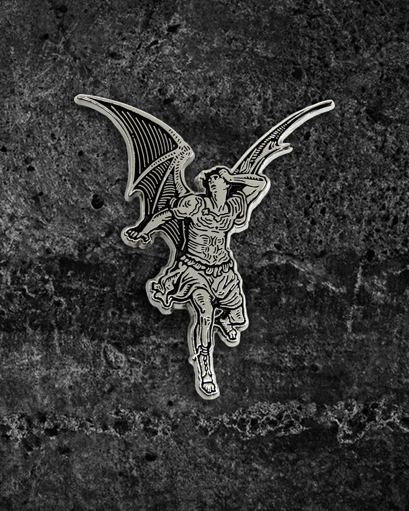 Large silver and black enamel gothic pin by Ectogasm inspired by Gustave Doré’s illustration for Milton’s "Paradise Lost," featuring a winged Lucifer fallen from grace. Measures 2.2 x 1.8 inches with dual metal clasps for secure wear, perfect for jackets, backpacks, or layering with other alternative pins in a collector’s set.