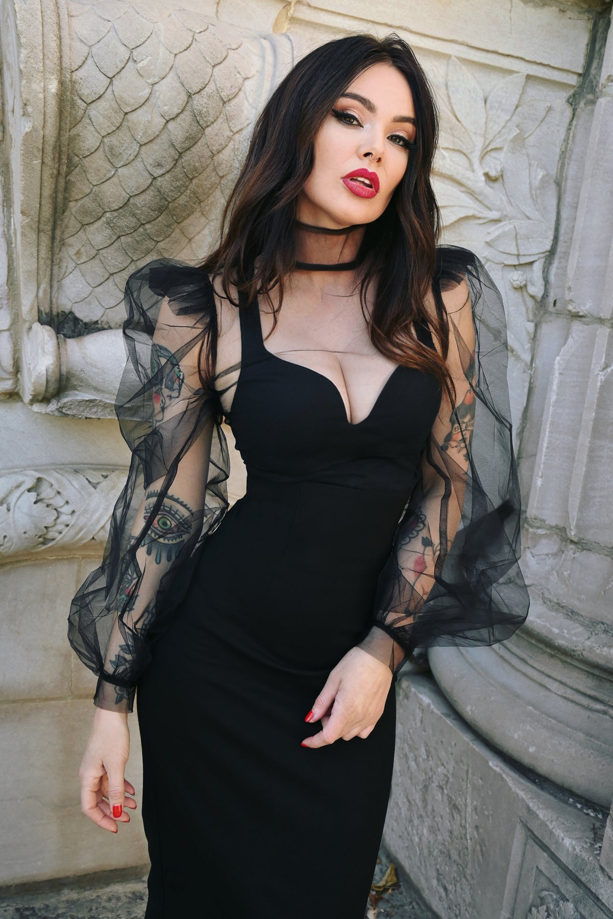 Dramatic sheer blouse made from lightweight stiff chiffon, featuring exaggerated puffy sleeves, high shoulders, and a tall structured collar, finished with a back-button closure for a couture-inspired statement piece suitable for Gothic and alternative wardrobes.