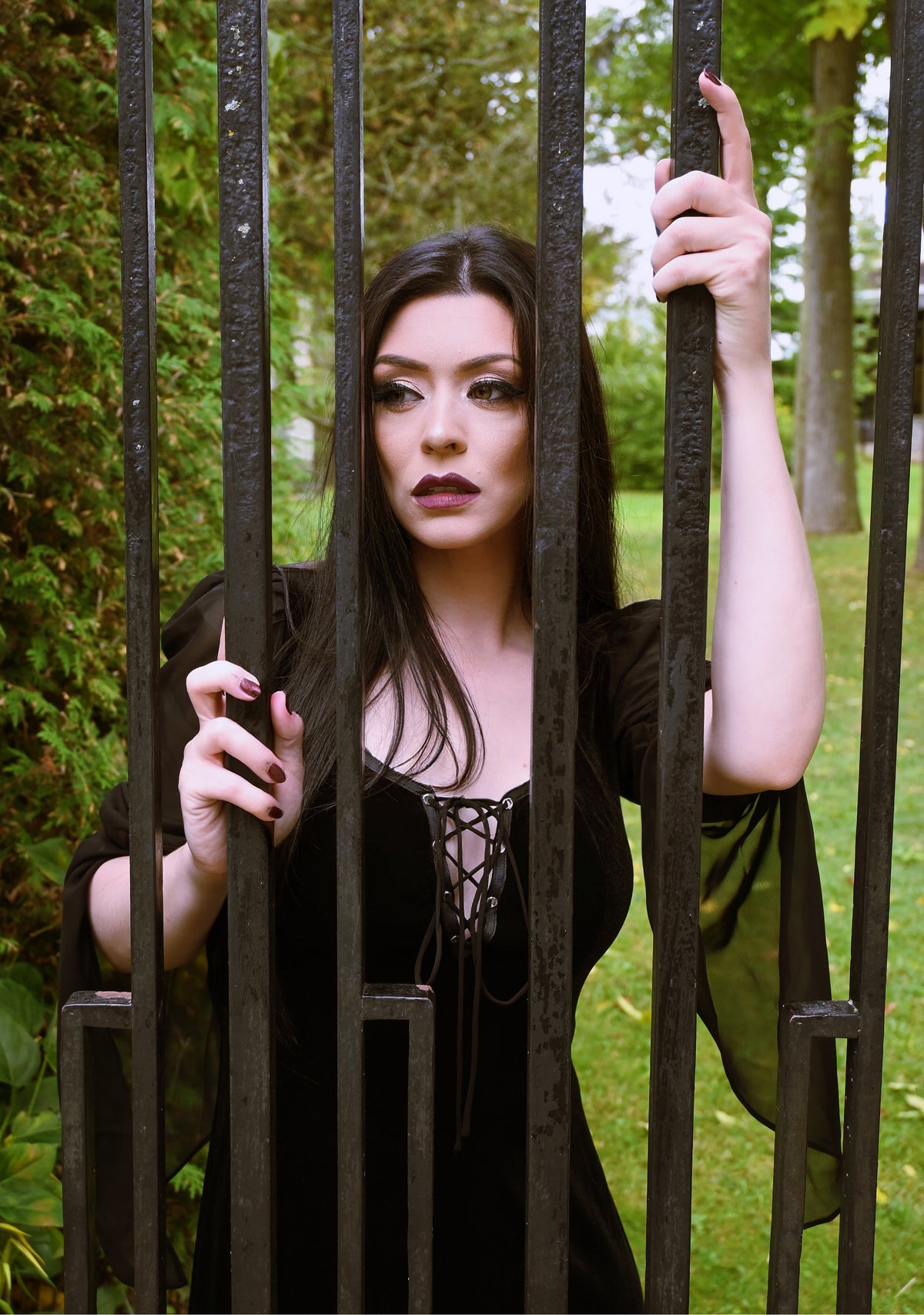 Authentic medieval-inspired velvet maxi dress with corset lace bust detailing and contrasting sheer black chiffon sleeves, offering a blend of Gothic elegance and comfort with its stretchy design, perfect for renaissance reenactments, cosplay, Gothic-themed weddings, or dramatic evening wear.