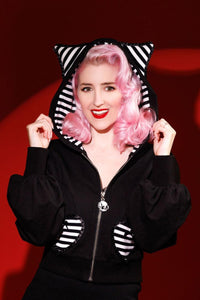 Jessica Louise Clothing & Katakomb Meow Kitty Sweater in black with oversized puff sleeves, whimsical striped cat ears, and heart-accented pockets, ideal for alternative fashion enthusiasts seeking nostalgic MySpace-inspired style.