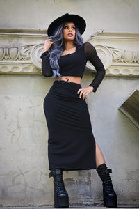 Elegant high-quality mesh two-piece set for women, including a form-fitting crop top with sheer long sleeves and a flattering square neckline, combined with a matching high-waisted pencil skirt featuring a side slit and subtle bow details, designed to accentuate curves and provide a comfortable yet stylish look ideal for date nights, cocktail parties, and evening events.