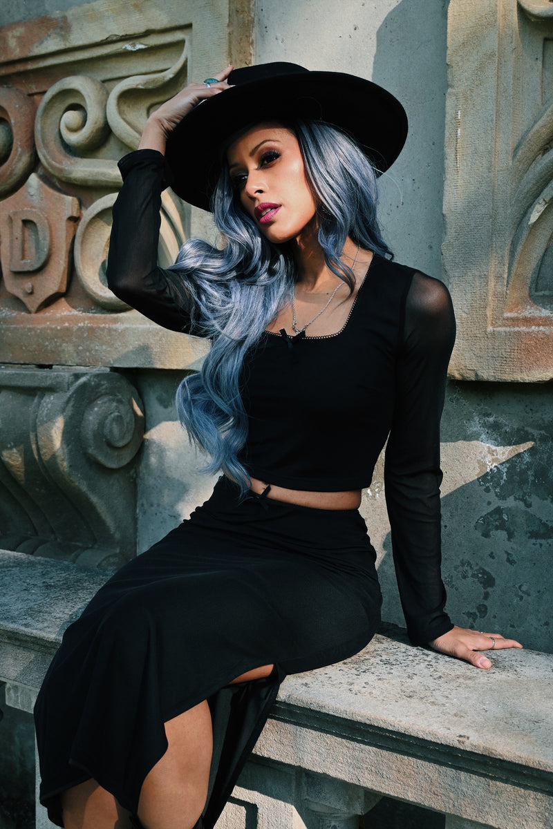 Modern and trendy women’s mesh two-piece set consisting of a fitted square-neck crop top with sheer long sleeves and a high-waisted pencil skirt with a side slit, crafted from soft and flexible polyester mesh, featuring subtle bow embellishments for a feminine touch, ideal for evening parties, clubwear, or stylish casual events.