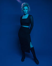 Flattering and comfortable women’s mesh two-piece set, including a fitted crop top with long sheer sleeves and a square neckline, and a high-waisted pencil skirt with a side slit, crafted from premium polyester mesh fabric with subtle bow details, designed for a stylish, body-hugging silhouette suitable for parties, evening events, and trendy night-out outfits.