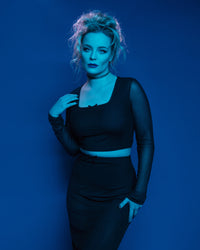 Elegant and trendy bodycon mesh two-piece set for women, combining a fitted square-neck crop top with sheer long sleeves with a high-waisted pencil skirt featuring a side slit, made from soft and stretchy polyester mesh, enhanced with small bow details for a feminine touch, suitable for night outs, special occasions, or stylish casual events.