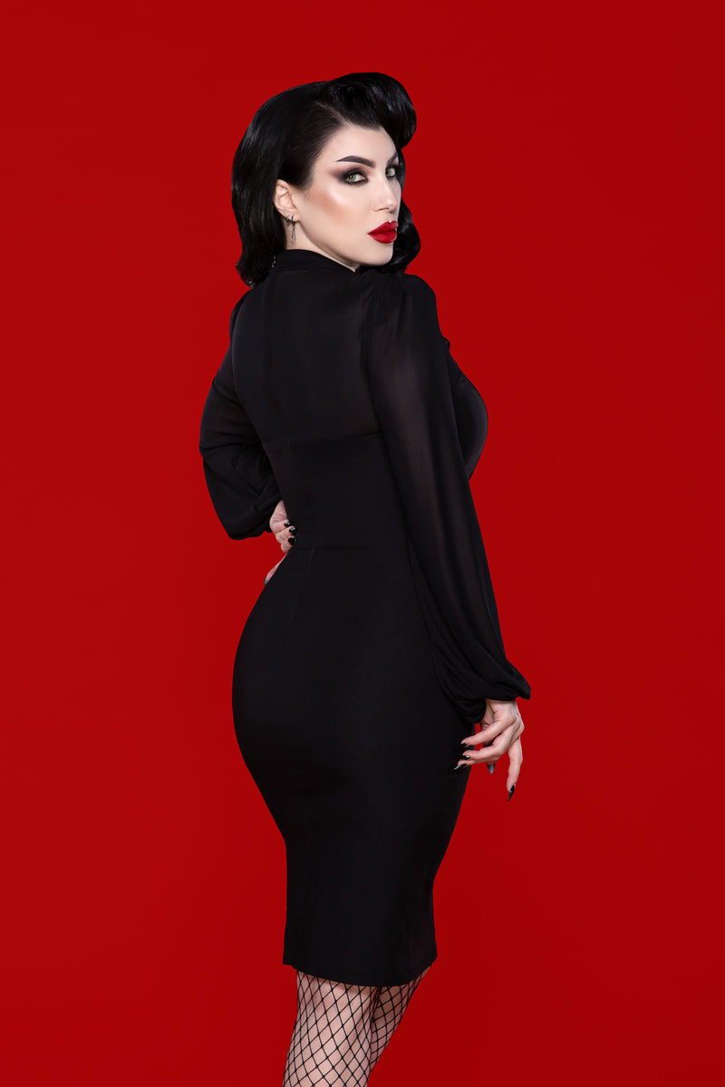 Dramatic black gothic dress with a fitted bengaline silhouette, featuring a sheer mesh neckline and billowing bishop sleeves, perfect for those who love alternative fashion, dark romantic styles, or attention-grabbing evening wear with a touch of elegance and mystery.