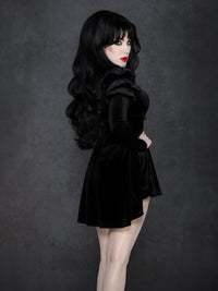 Stretch velvet babydoll top with draped silhouette, gathered shoulder detail, and adjustable corset lacing at the bust, styled with coordinating high-waisted velvet bloomers.