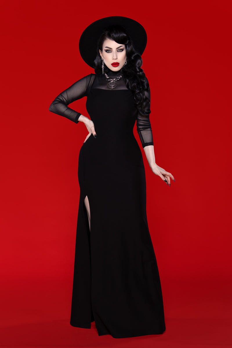 This stunning Onyx black maxi dress combines timeless style with modern comfort, featuring a body-skimming fit in dense, ultra-stretch fabric that effortlessly moves with you. Its adjustable spaghetti straps and high side slit create a flattering and feminine look, perfect for formal occasions, luxury resort wear, or statement evening outfits.