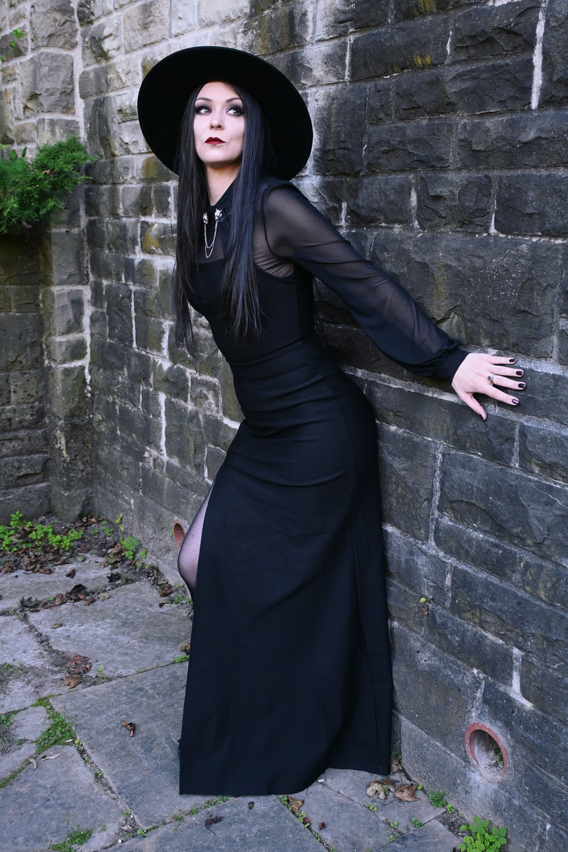 This black Onyx maxi dress from 
Katakomb is crafted with thick, high-quality stretch fabric that fits like a glove while remaining breathable and comfortable. The sleek pull-on design eliminates the need for a zipper, while the adjustable straps and thigh-high slit add both practicality and allure, ideal for women seeking a minimalist yet daring evening gown.