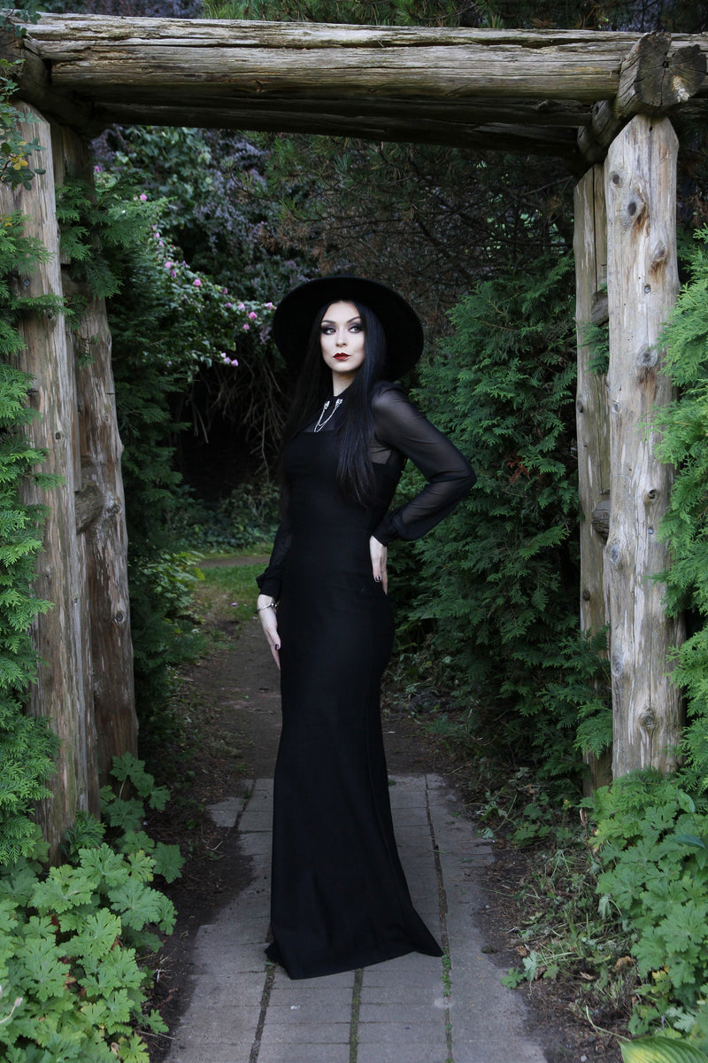 The Onyx Dress is a statement piece for those who love understated glamour. This long black stretch maxi features a sleek body-con fit, adjustable spaghetti straps, and a daring high side slit. Made from thick, elastic material with no zipper, it offers ease of wear and all-day comfort while exuding a chic, confident style suited for elegant evenings and upscale events.