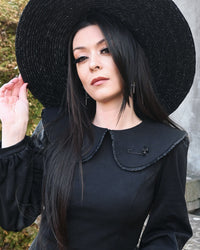 Stylish matte black safety pin brooch with detailed skull accent, 2 inches in length. Ideal for gothic or alternative fashion lovers, this small but striking accessory enhances collars, lapels, or coats with bold individuality.