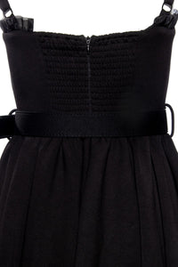 Luxurious Love Bites Swing Dress by Jessica Louise, crafted from high-stretch black poly blend with a classic fit-and-flare shape, featuring a sweetheart bustline with playful ruffles and a ribbon bow, enhanced cup sizing for comfort, convenient side seam pockets, ruched backing for effortless wear, and adjustable straps for a personalized, flattering fit, perfect for making a bold, stylish statement while staying comfortable all day.