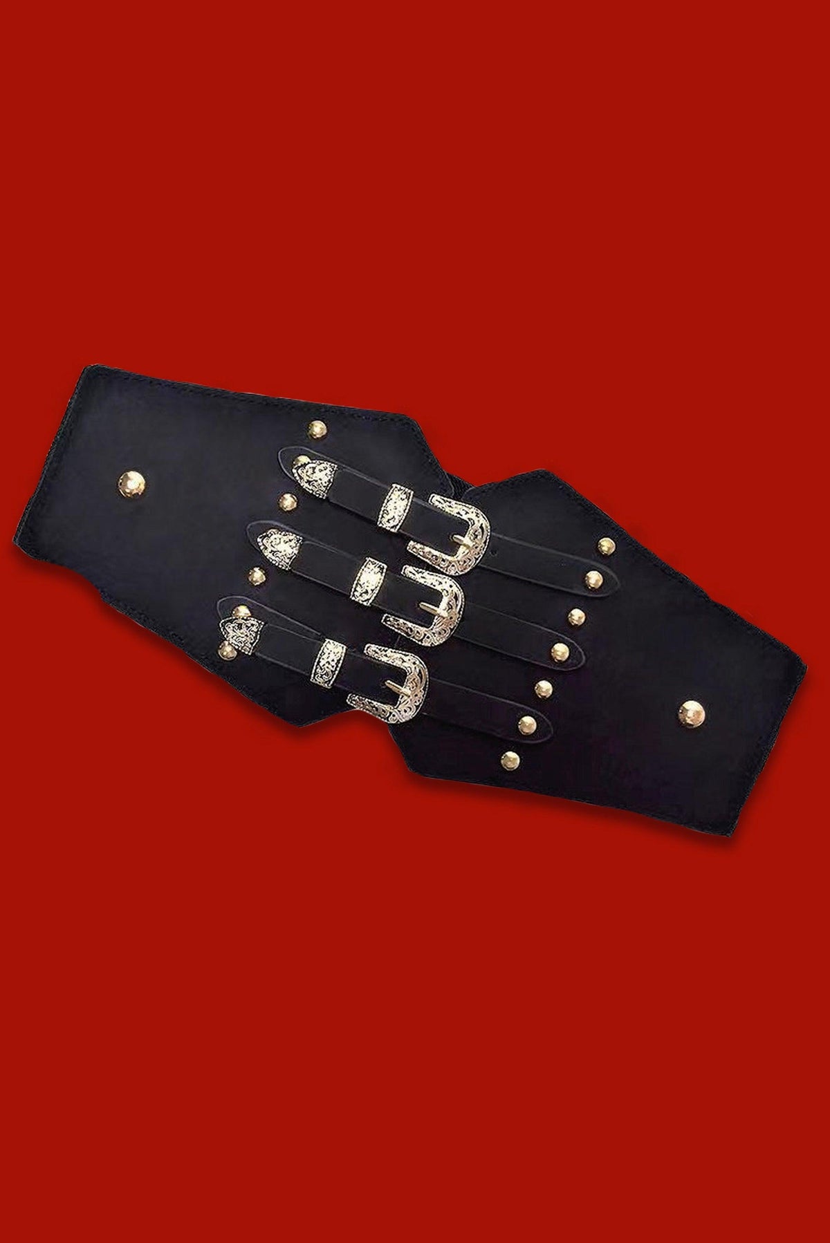 Triple Buckle Belt in black vegan leather featuring three parallel silver buckles and a stretchy back panel for a comfortable fit. Perfect for gothic, alternative, or edgy street-style outfits, ideal for cinching dresses, coats, or oversized shirts.